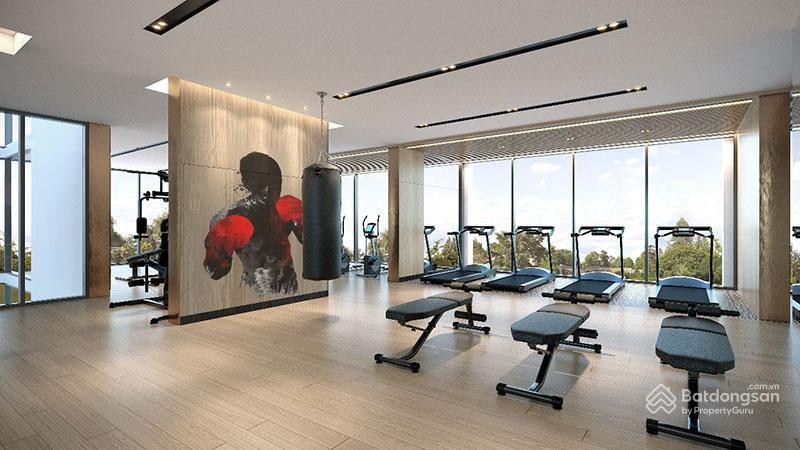 A room with exercise equipment and a large windowDescription automatically generated